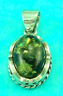 great jewelry sale group presents an amber pendant with round oval shape with nice decoration on the side 